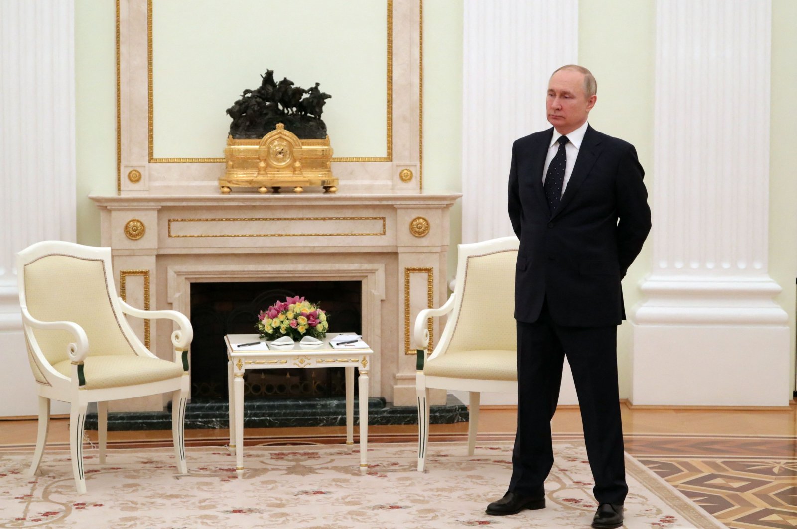 Russian President Vladimir Putin stands in a hall prior to a meeting at the Kremlin in Moscow, Russia, March 11, 2022. (AFP Photo)