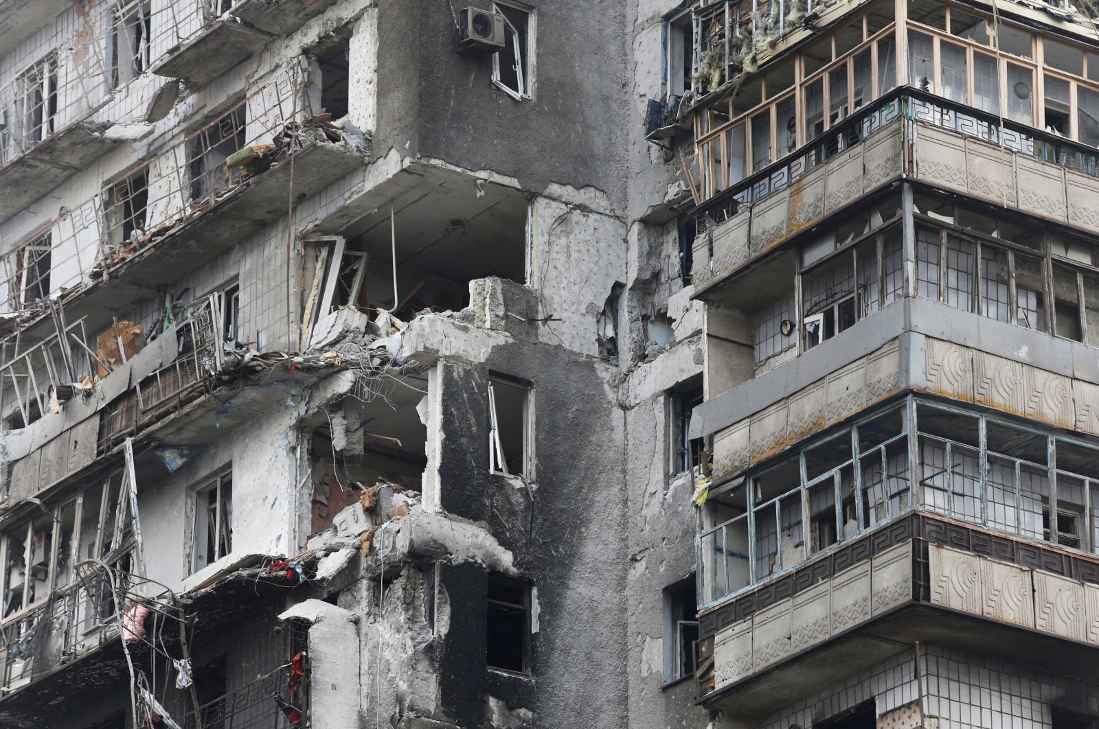 A residential building damaged during the Ukraine-Russia conflict in the besieged southern port city of Mariupol, Ukraine, March 18, 2022. (REUTERS Photo)