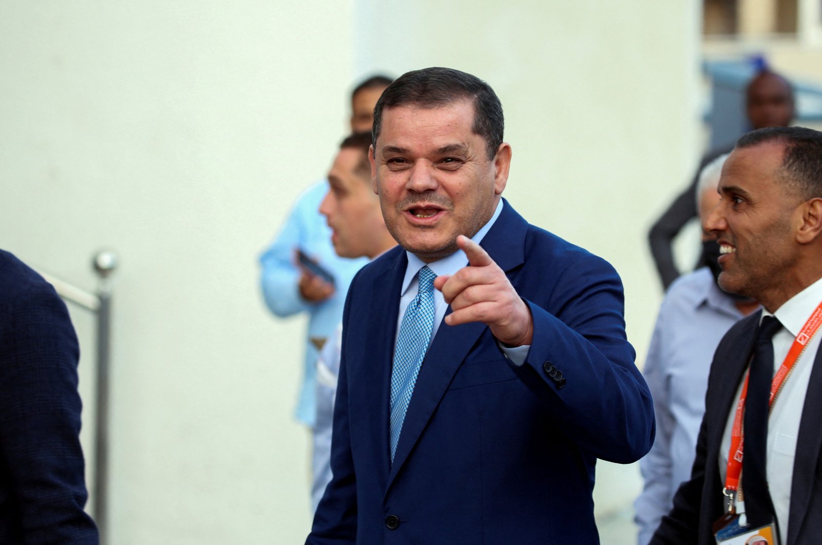 Libyan Prime Minister Abdulhamid Dbeibah gestures as he arrives to submit his candidacy papers for the upcoming presidential election at the headquarters of the electoral commission in Tripoli, Libya Nov. 21, 2021. (Reuters File Photo)