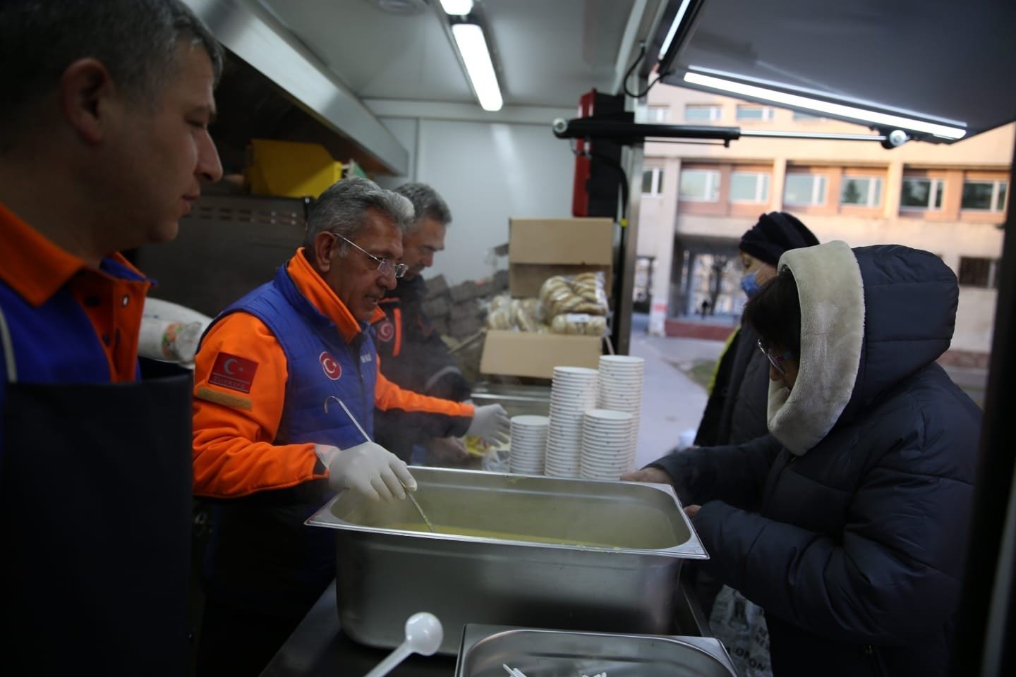 AFAD workers distribute warm food to locals in need in Lviv, Ukraine, March 20, 2022. (IHA Photo)