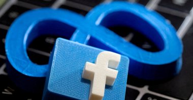 3D-printed images of the logos of Facebook and parent company Meta Platforms are seen on a laptop keyboard in this illustration taken on Nov. 2, 2021. (Reuters Photo)