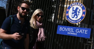 People walk past Chelsea's stadium Stamford Bridge, London, England, March 18, 2022. (AFP Photo)