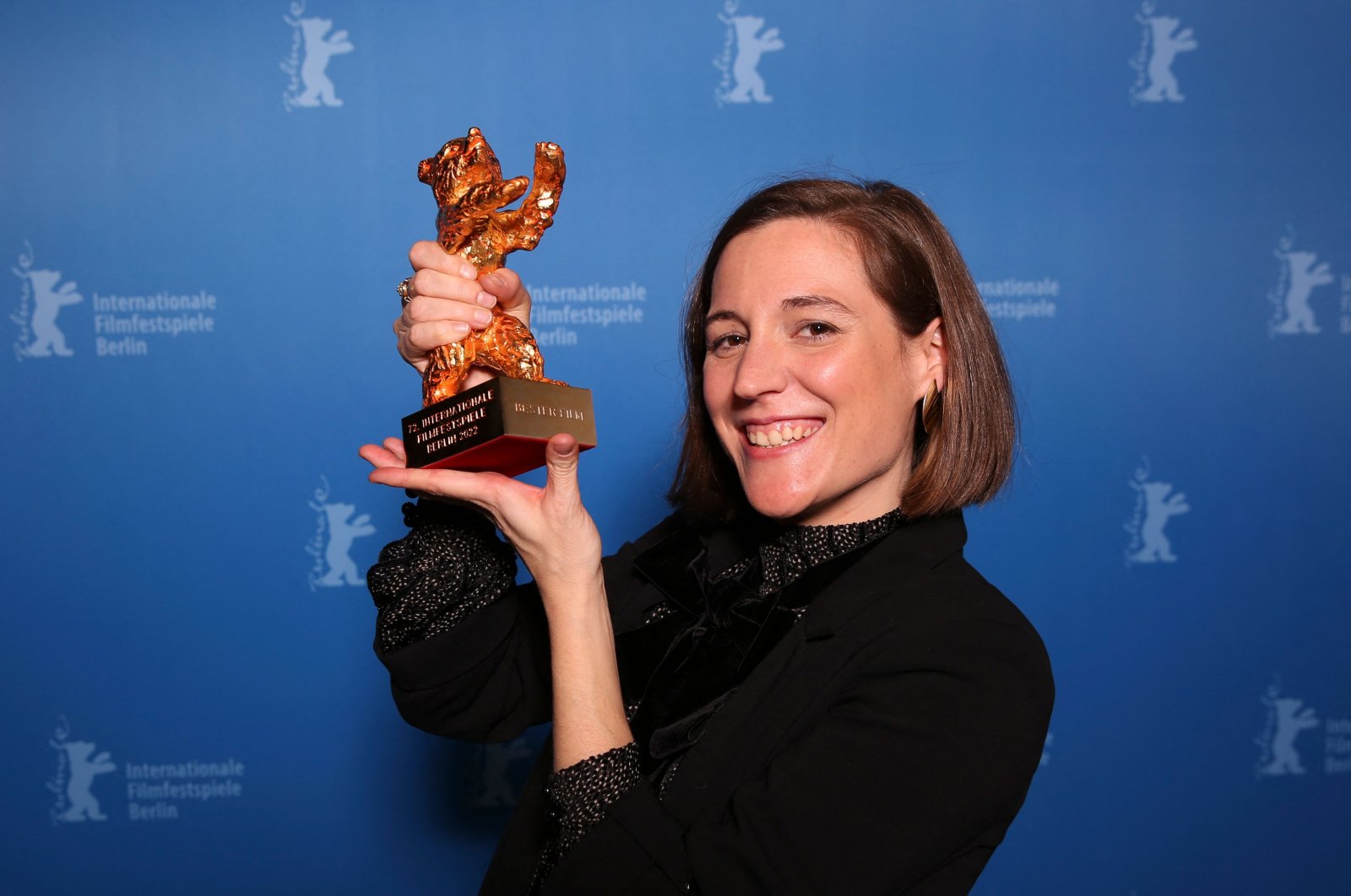In this file photo taken on February 16, 2022 Spanish director and screenwriter Carla Simon poses during a photo call after being awarded the Golden Bear for Best Film award for the film "Alcarras" after the awards ceremony of the 72nd Berlinale Film Festival in Berlin. (AFP)