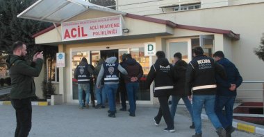 Police escort suspects captured in an operation against FETÖ to a medical check, in the capital Ankara, Turkey, March 15, 2022. (AA Photo)