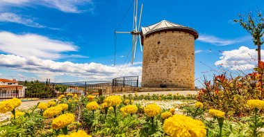 Windmills shine in the sun in Alaçatı town of Çeşme, in Izmir, western Turkey, June 2, 2021. (Shutterstock Photo)