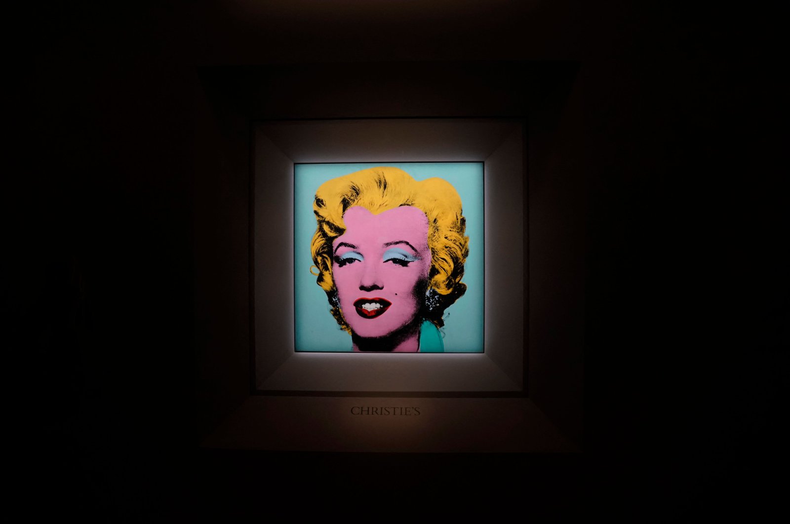 Andy Warhol’s 1964 &quot;Shot Sage Blue Marilyn&quot; displayed during a press preview,  New York, U.S., March 21, 2022. (AFP)