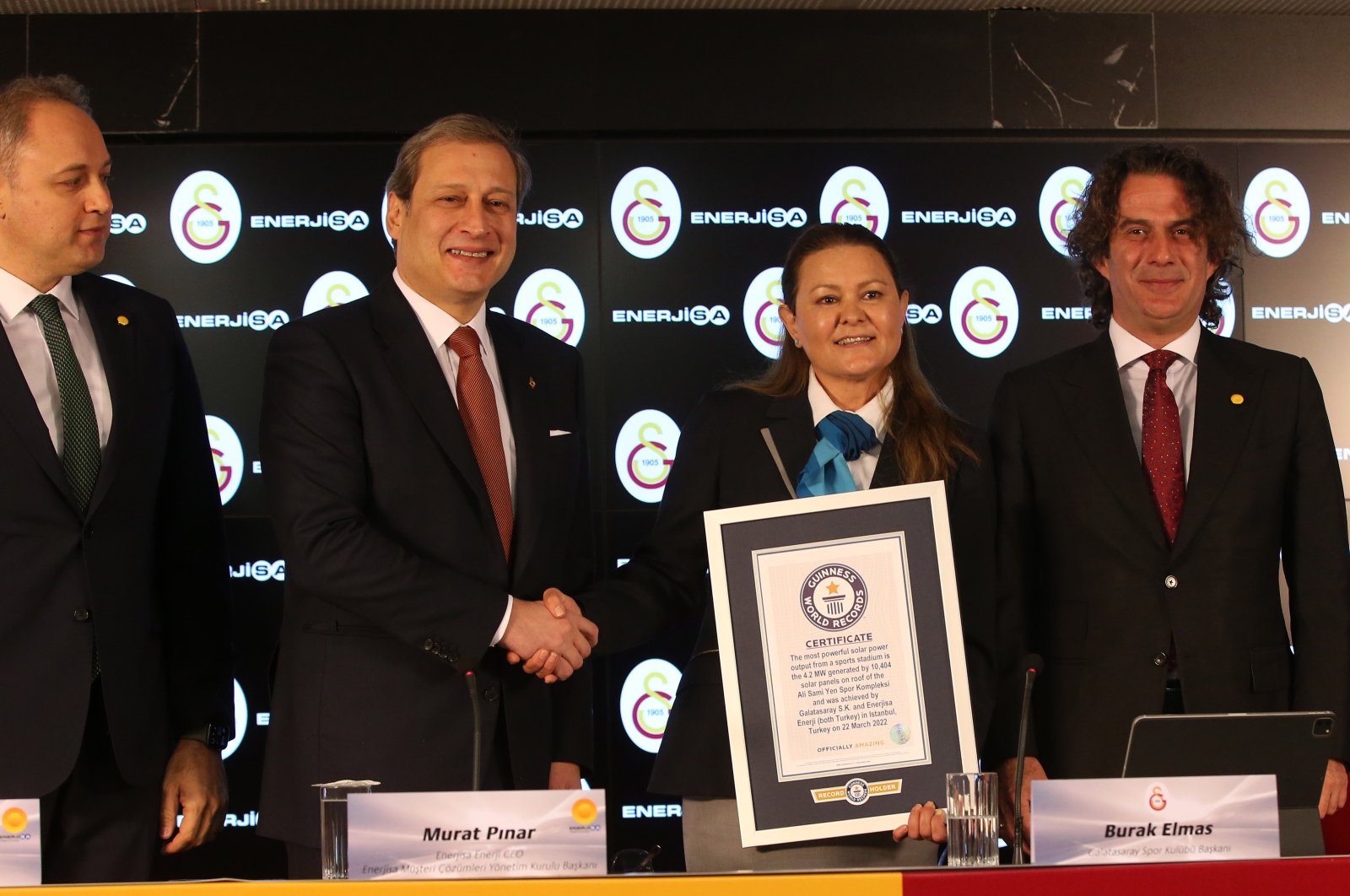 Officials from Galatasaray Sports Club and energy company Enerjisa attend a ceremony to mark the Guinness Book of World Records listing of the club&#039;s joint solar energy plant project, Istanbul, Turkey, March 22, 2022. (DHA Photo)