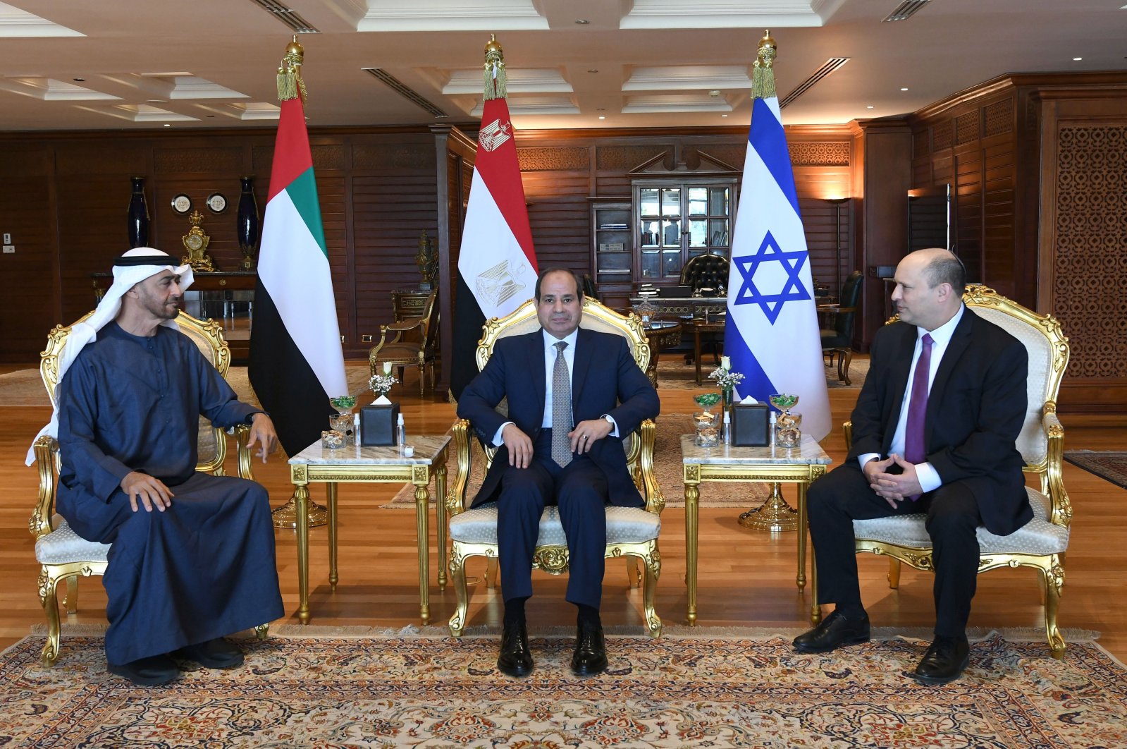 A handout photo made available by the Egyptian presidency shows Egyptian President Abdel Fattah el-Sisi (C), Abu Dhabi Crown Prince Mohammed bin Zayed (L) and Israeli Prime Minister Naftali Bennett during their meeting in Sharm el-Sheikh, Egypt, March 22, 2022. (EPA Photo)
