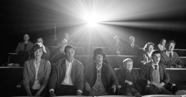 From left to right, Caitriona Balfe as &quot;Ma,&quot; Jamie Dornan as &quot;Pa,&quot; Judi Dench as &quot;Granny,&quot; Jude Hill as &quot;Buddy&quot; and Lewis McAskie as &quot;Will&quot; in director Kenneth Branagh&#039;s &quot;Belfast.&quot;  (Courtesy of Focus Features)