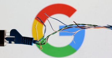 A broken ethernet cable is seen in front of the Google logo in this illustration taken March 11, 2022. (Reuters File Photo)