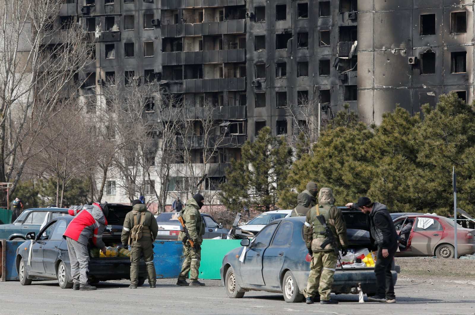 Service members of pro-Russian troops check cars during Ukraine-Russia conflict in the besieged southern port city of Mariupol, Ukraine, March 20, 2022. (Reuters Photo)