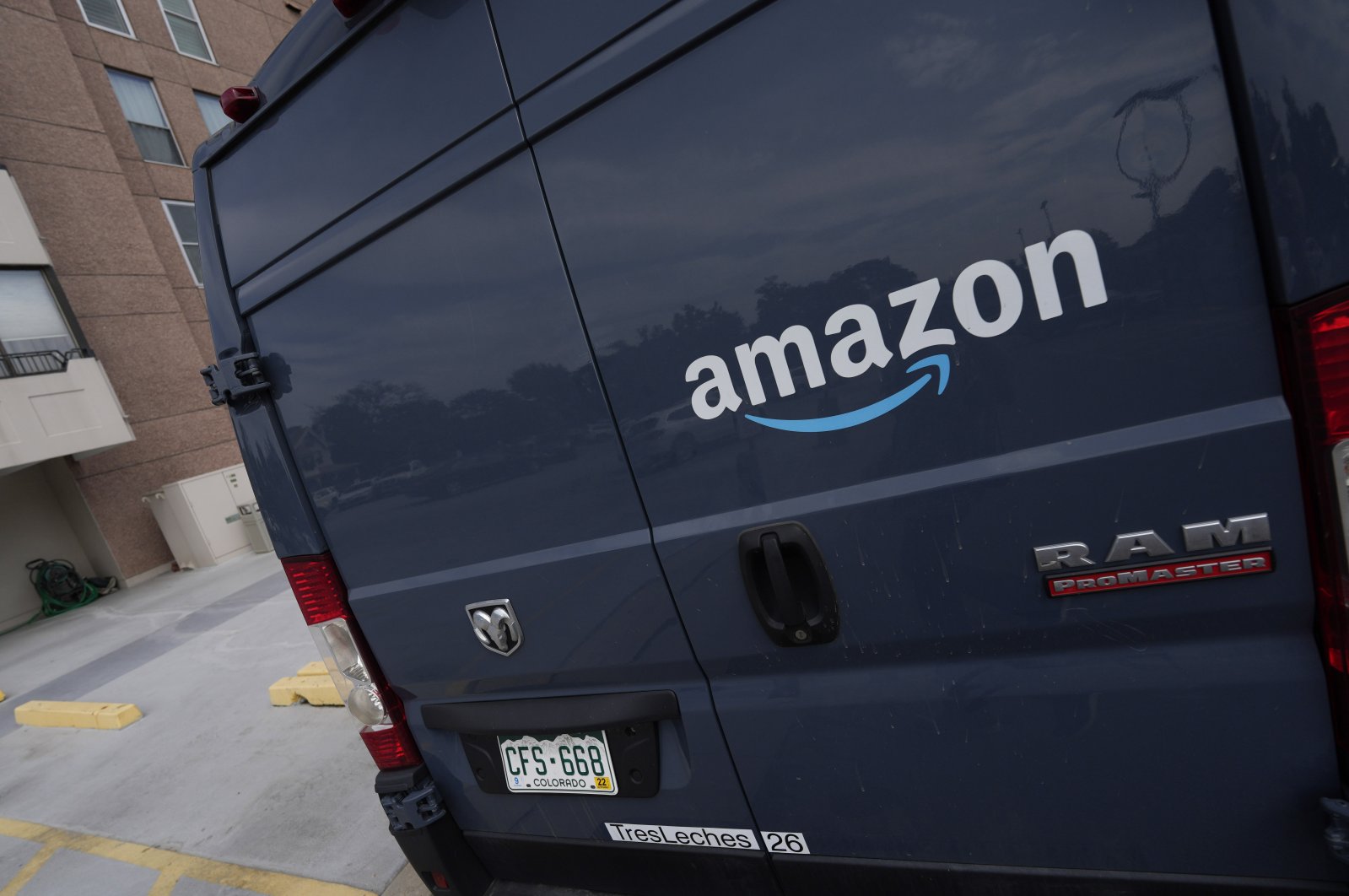 Amazon&#039;s company logo graces one of the doors of a delivery van in Denver, U.S., Sept. 1, 2021. (AP Photo)
