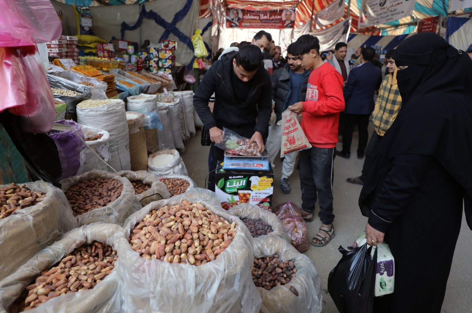 A vendor sells dates at a market of Arish city, north of Sinai governorate, Cairo, Egypt, March 22, 2022. (EPA Photo)