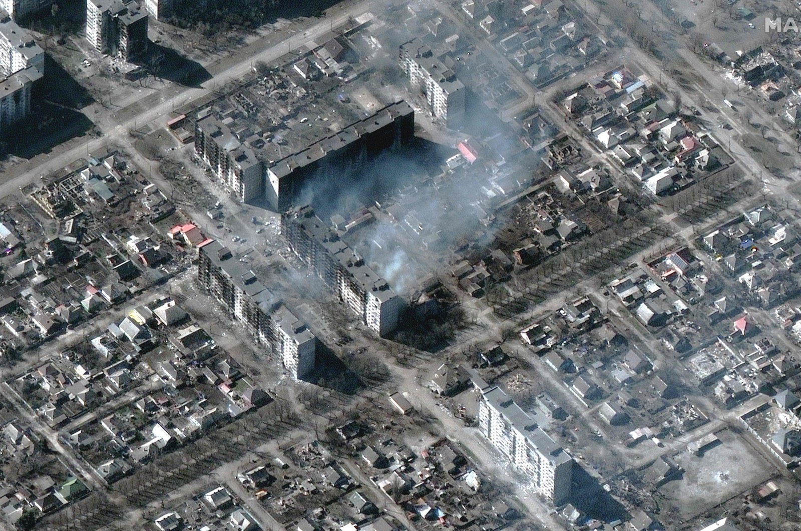 Burning and destroyed high-rise apartments are seen in this Maxar satellite image taken in Mariupol, Ukraine on March 22, 2022. (Maxar Technologies Satellite Image/ AFP)