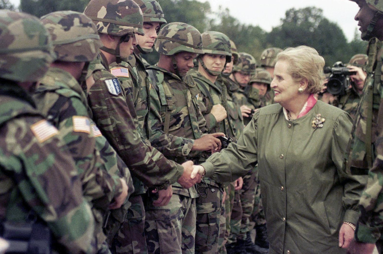U.S. Secretary of State Madeleine Albright shakes hands with U..S soldiers during her visit to Air Base Eagle near Tuzla, Bosnia-Herzegovina, Aug. 30, 1998. (AP Photo)