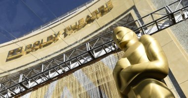 An Oscar statue is pictured underneath the entrance to the Dolby Theater on Feb. 24, 2016, in Los Angeles. The Oscars will be held on Sunday, March 27 at the Dolby Theatre in Los Angeles. (AP Photo)