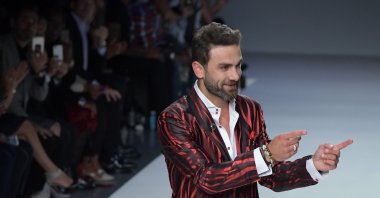 Designer Peyman Umay greets the audience after a fashion show during New York Fashion Week, New York, U.S., Sept. 7, 2017. (Shutterstock Photo)
