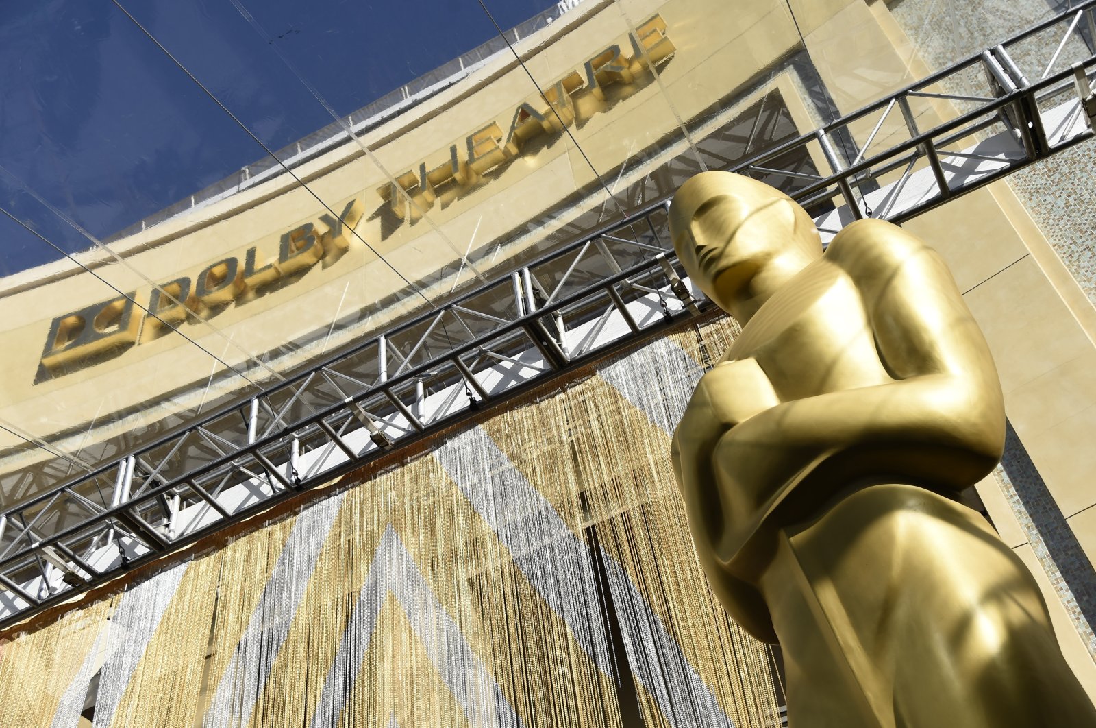 An Oscar statue is pictured underneath the entrance to the Dolby Theater on Feb. 24, 2016, in Los Angeles. The Oscars will be held on Sunday, March 27 at the Dolby Theatre in Los Angeles. (AP Photo)
