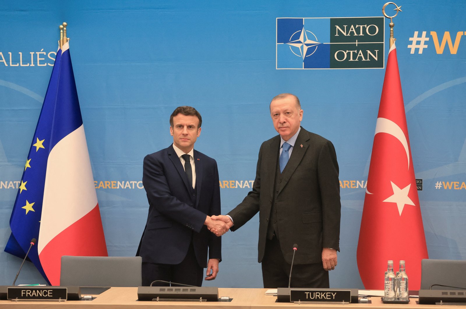 President Recep Tayyip Erdoğan and French President Emmanuel Macron shake hands as they attend a bilateral meeting ahead of a NATO summit to discuss Russia&#039;s invasion of Ukraine, at the alliance&#039;s headquarters in Brussels, Belgium, March 24, 2022. (Reuters Photo)