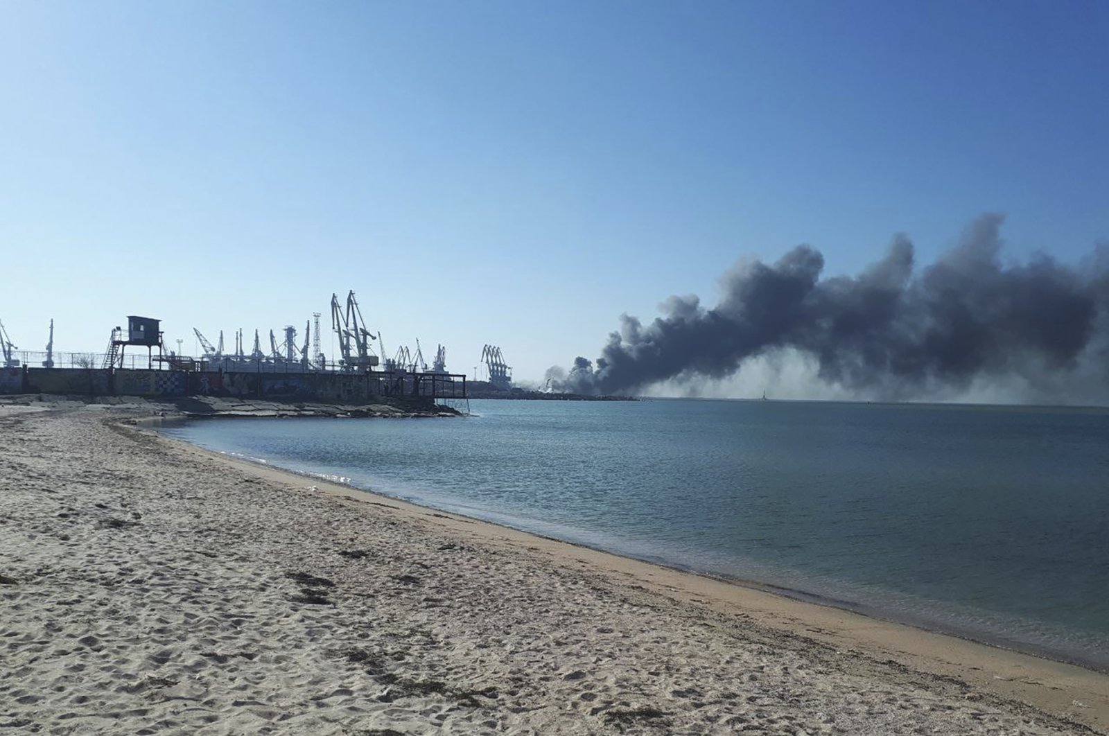 Smoke rises after shelling near a seaport in Berdyansk, Ukraine, March 24, 2022. (AP Photo)