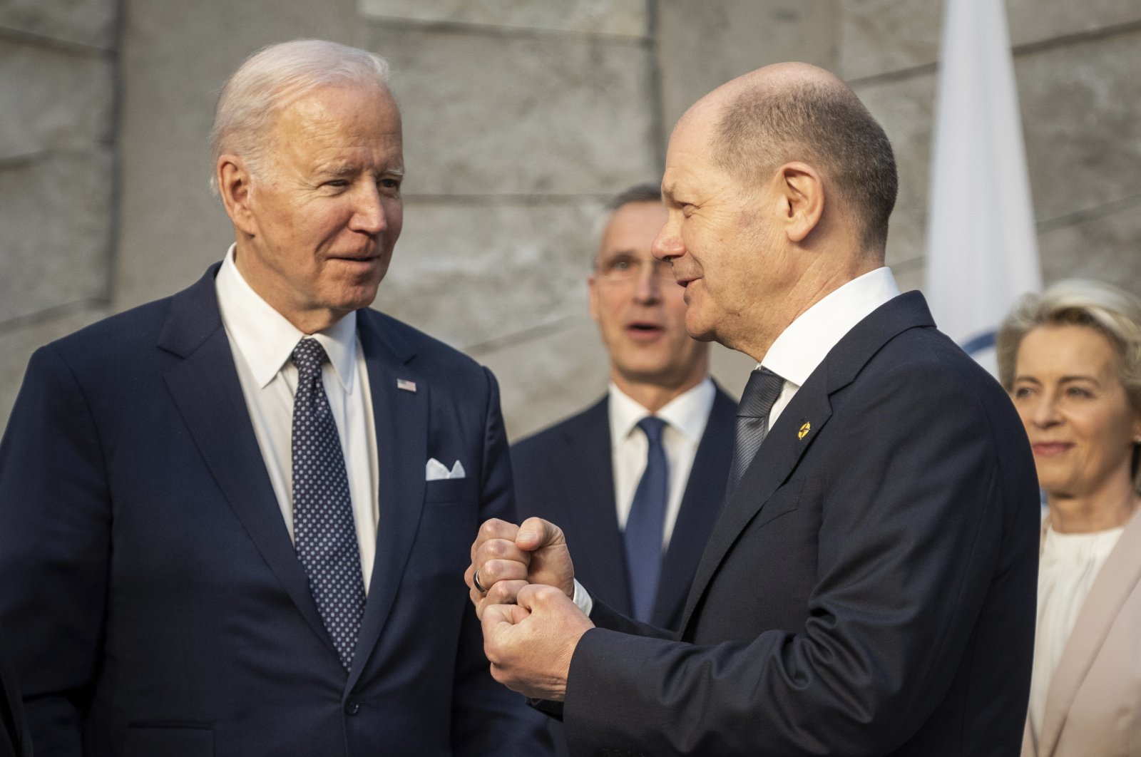 U.S. President Joe Biden (L) and German Chancellor Olaf Scholz (R) talk during an extraordinary NATO summit at NATO headquarters in Brussels, Belgium, Thursday, March 24, 2022. (DPA via AP, Pool)