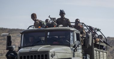 Ethiopian government soldiers ride in the back of a truck on a road near Agula, north of Mekelle, in the Tigray region of northern Ethiopia, May 8, 2021. (AP Photo)