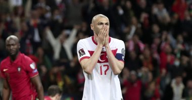 Turkey striker Burak Yılmaz reacts after missing a penalty shot during the World Cup qualifier match against Portugal, at the Dragao stadium in Porto, Portugal, March 24, 2022. (AP Photo)