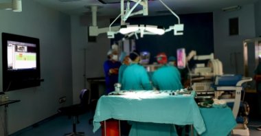 Staff operates on a patient in the operating theater of a hospital in Izmir, western Turkey, Jan. 16, 2022. (AA PHOTO)