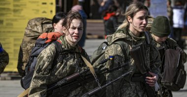 Female Ukrainian soldiers walk in a train station in the western city of Lviv, Ukraine, March 25, 2022. (AA Photo)