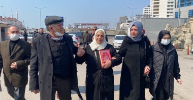 Beyhan Cengiz (C), the mother of the victim, walks outside the courthouse, in Istanbul, Turkey, March 25, 2022. (İHA PHOTO)