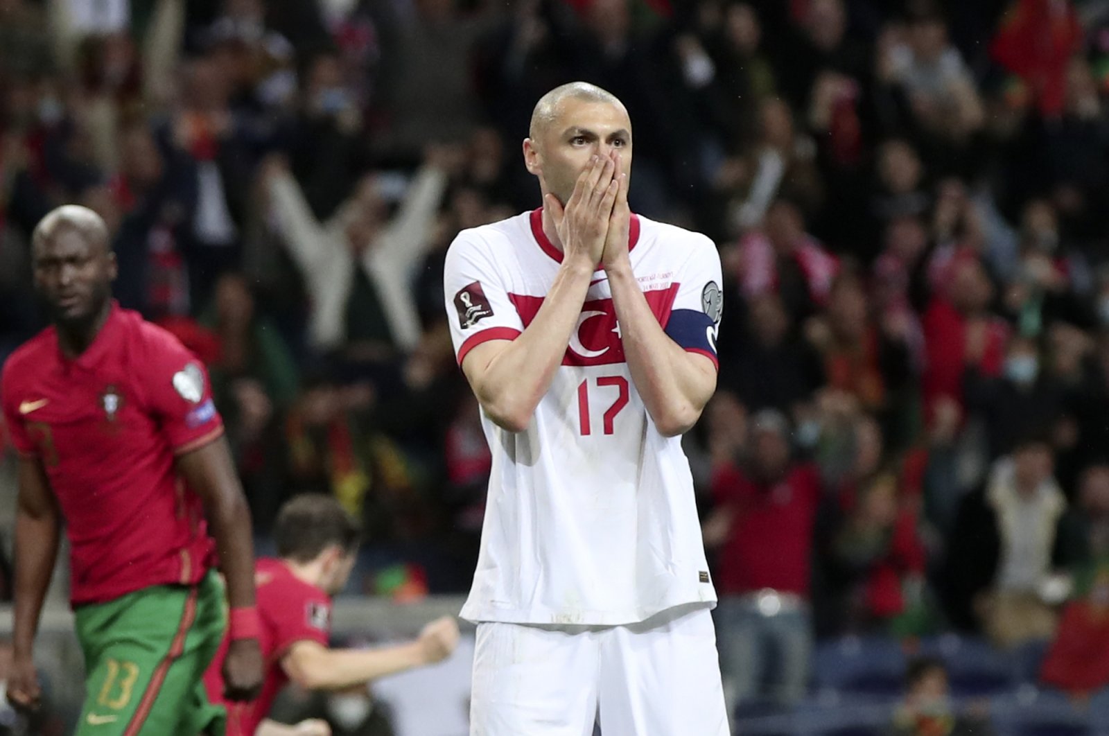 Turkey striker Burak Yılmaz reacts after missing a penalty shot during the World Cup qualifier match against Portugal, at the Dragao stadium in Porto, Portugal, March 24, 2022. (AP Photo)