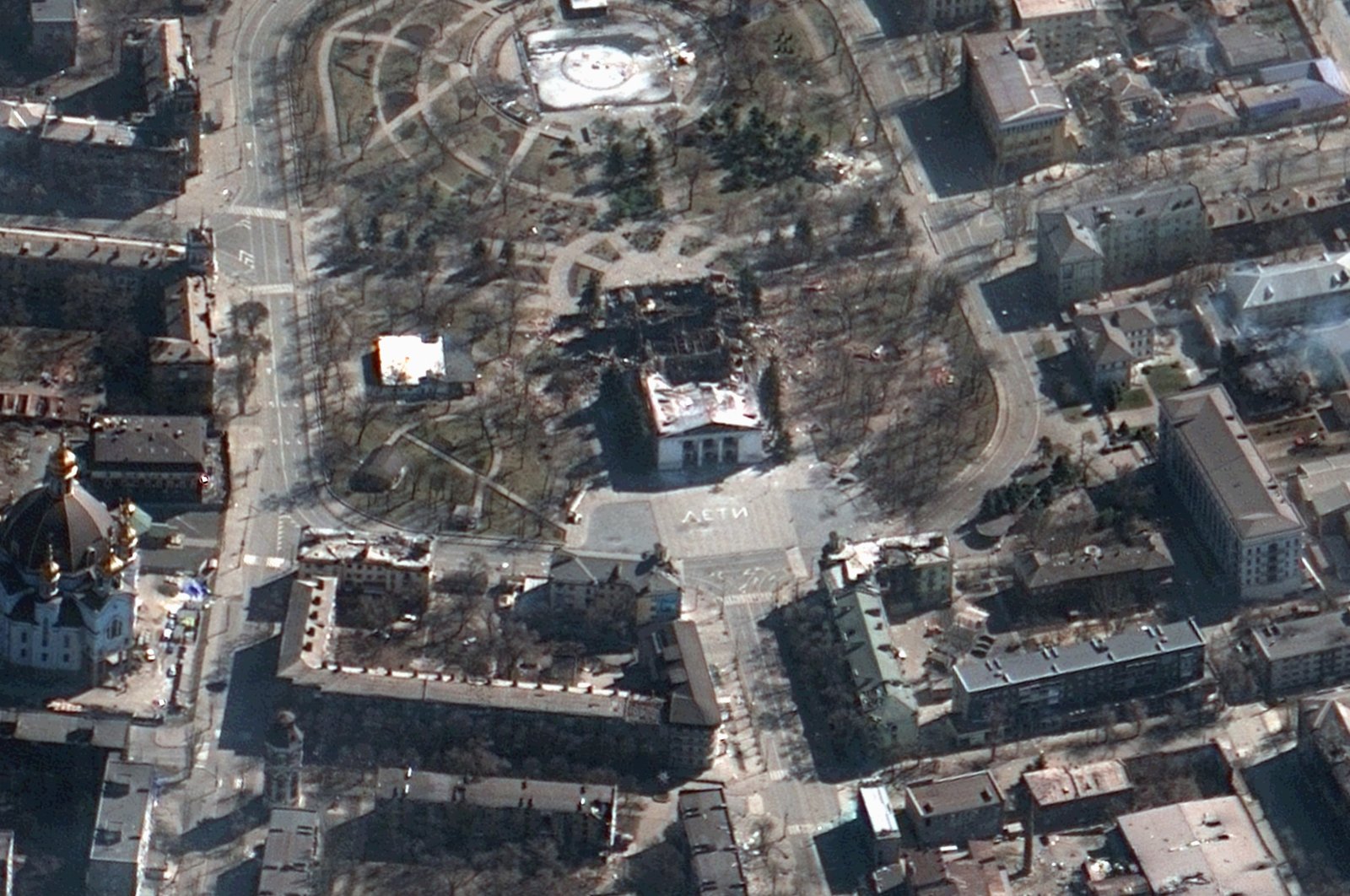This satellite image provided by Maxar Technologies on Saturday, March 19, 2022, shows the aftermath of the airstrike on the Mariupol Drama theater and the area around it, Mariupol, Ukraine. (Satellite image ©2022 Maxar Technologies via AP)