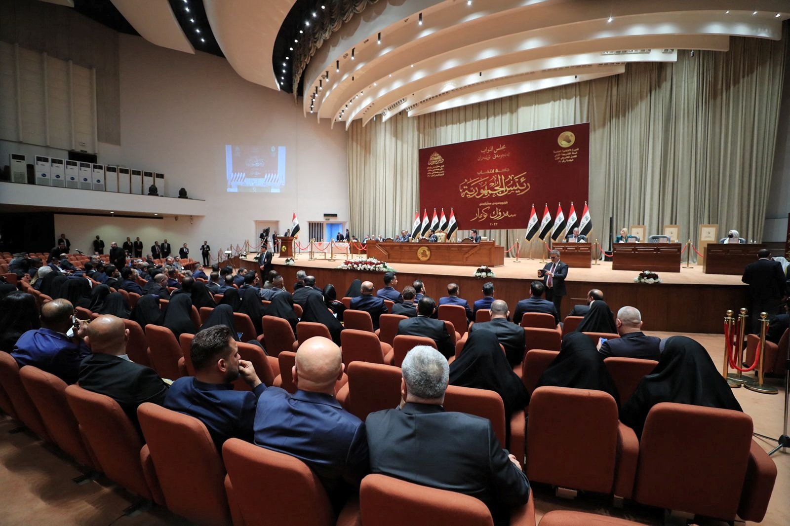 Iraqi deputies attend a session of the Iraqi Parliament in Baghdad, Iraq, March 26, 2022. (Iraqi Parliament Media Office/Handout via Reuters) 