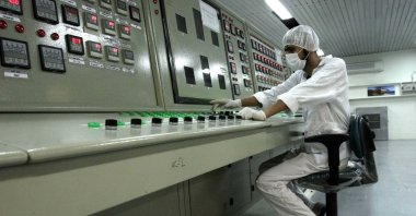 In this Feb. 3, 2007 file photo, an Iranian technician working at the Uranium Conversion Facility just outside the city of Isfahan, Iran, 255 miles (410 kilometers) south of the capital Tehran. (AP Photo)