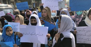 Afghan women chant and hold signs of protest during a demonstration in Kabul, Afghanistan, Saturday, March 26, 2022. (AP Photo)