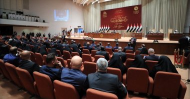 Iraqi deputies attend a session of the Iraqi Parliament in Baghdad, Iraq, March 26, 2022. (Iraqi Parliament Media Office/Handout via Reuters) 