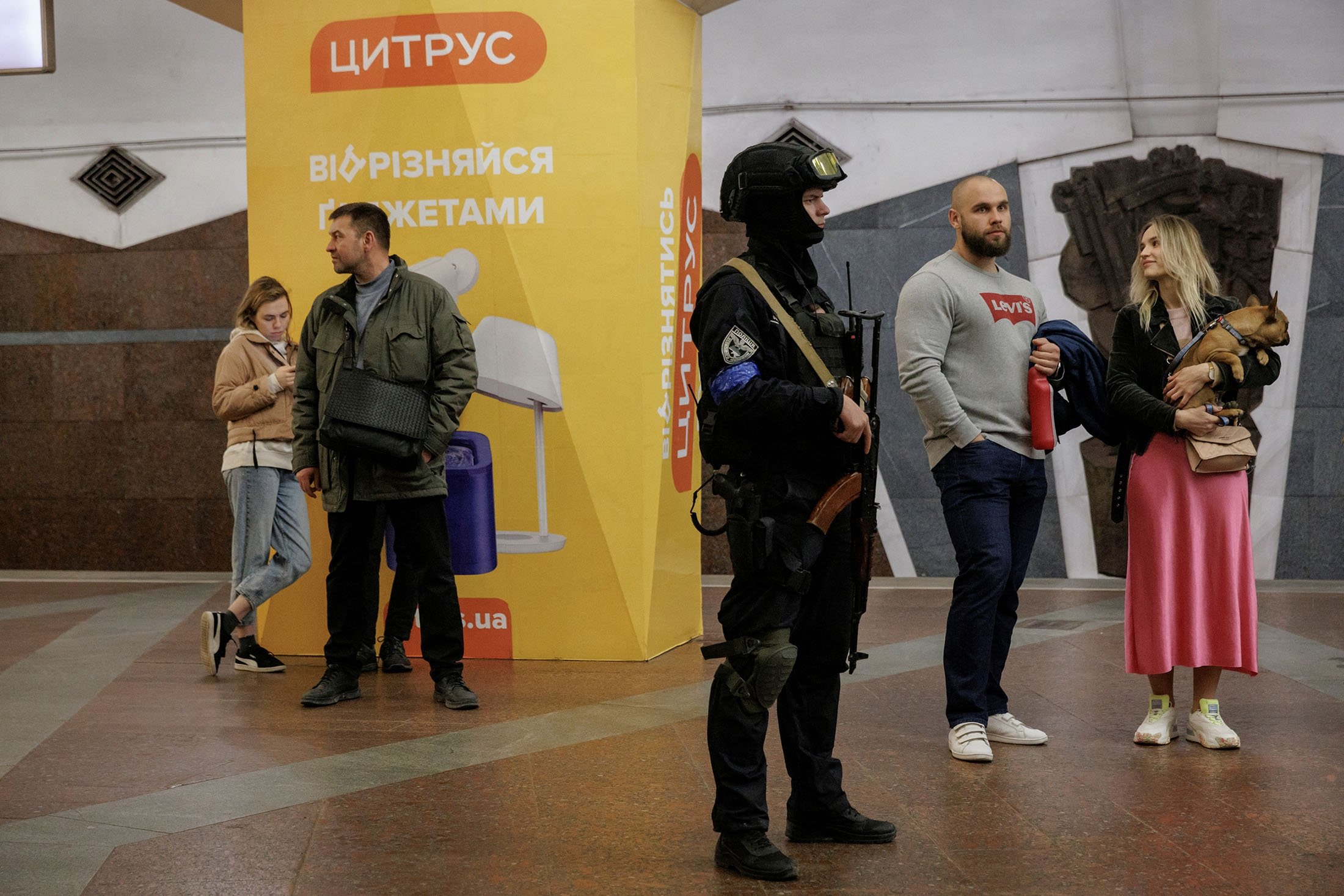 People wait for the start of a classical music concert performed by local musicians at a metro station that serves as a bomb shelter as the Russian attack on Ukraine continues in Kharkiv, Ukraine, on 26 March 2022. (Photo Reuters)