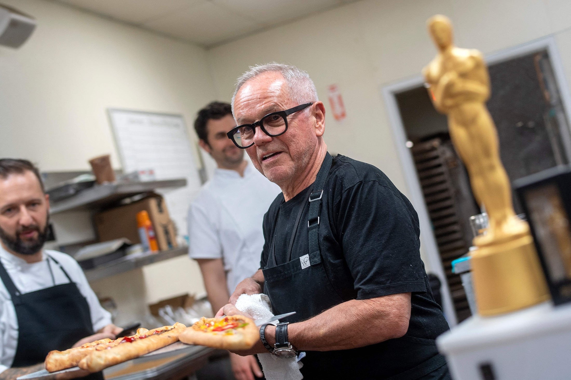 Chef Wolfgang Puck poses with pide fresh out of the oven at the 94th Annual Academy Awards Governors Ball Press Preview held at the Hollywood And Highland Center, in Hollywood, California, U.S., March 24, 2022. (AFP Photo)