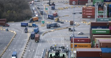 Tractor-trailers loaded with shipping containers drive through a traffic circle in the container yard at the Georgia Ports Authority's Garden City Terminal, U.S. Feb. 2, 2022. (AP Photo)