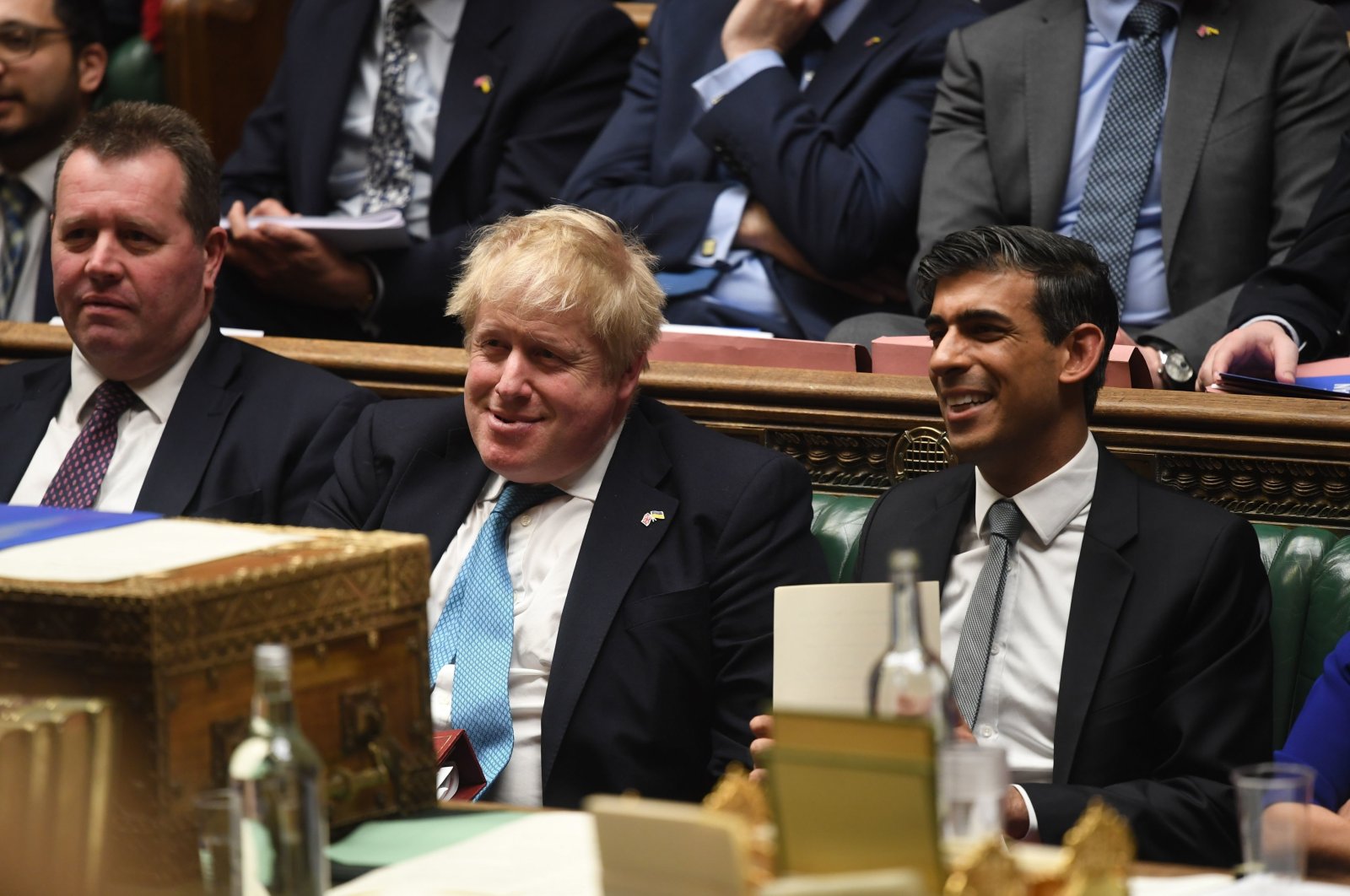 Britain&#039;s Chancellor of the Exchequer Rishi Sunak sits next to Prime Minister Boris Johnson after delivering his Spring Statement in the House of Commons in London, March 23, 2022. (U.K. Parliament via AP)