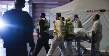 Israeli Zaka Rescue and Recovery team carry the body of a victim at the scene of shooting attack In Hadera, Israel, March 27, 2022. (AP Photo)