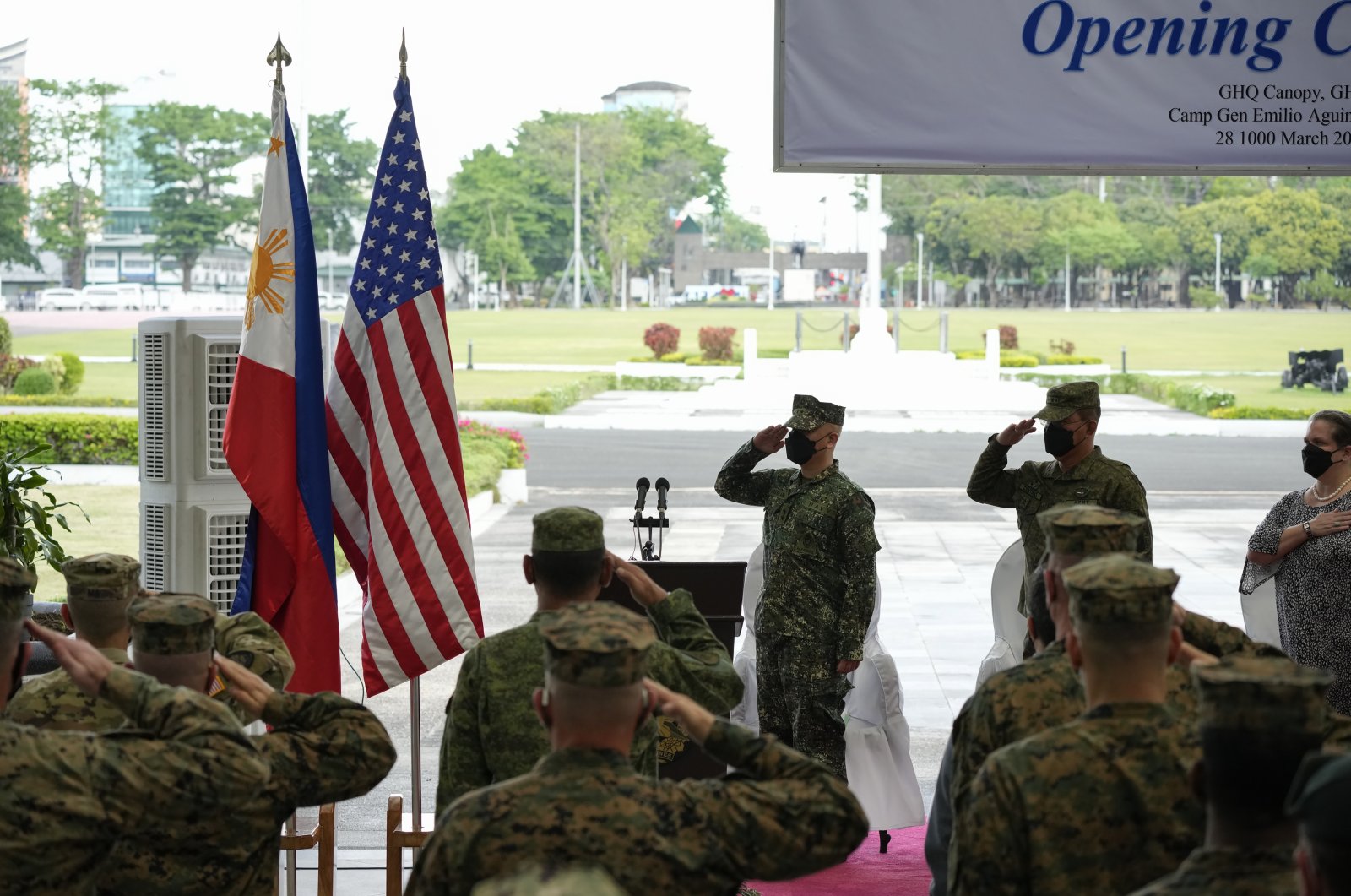 Philippine and U.S. soldiers salute to their flags as the national anthem is played during opening ceremonies of the &quot;Balikatan&quot; or &quot;Shoulder to Shoulder&quot; joint military exercises at Camp Aguinaldo, Quezon City, Philippines, March 28, 2022. (AP Photo)