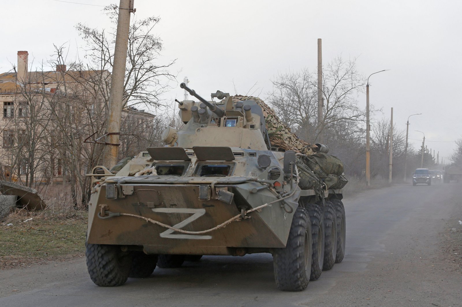 An armoured vehicle of pro-Russian troops with the symbol &quot;Z&quot; painted on its front drives along a road during Ukraine-Russia conflict near the besieged southern port city of Mariupol, Ukraine, March 27, 2022. (Reuters Photo)