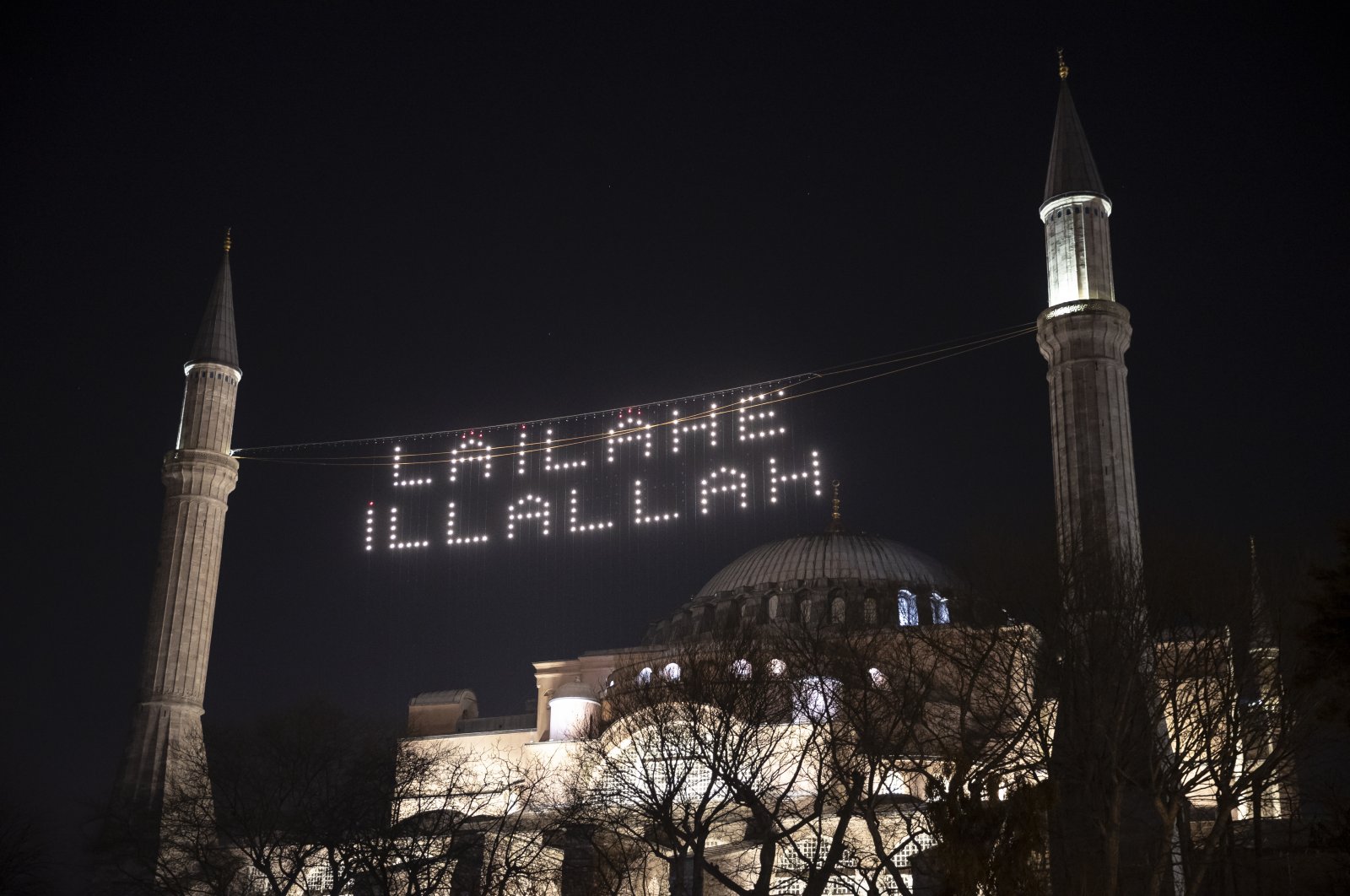 The minarets of Hagia Sophia Mosque with the installation of a mahya that reads “La ilaha illallah” (There is no god truly worthy of worship except Allah), Istanbul, Turkey, March 28, 2022. (AA Photo)