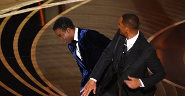 Will Smith (R) slaps Chris Rock onstage during the 94th Oscars at the Dolby Theater in Hollywood, California, U.S., March 27, 2022. (AFP File Photo)