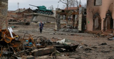 A local resident walks next to buildings damaged by shelling, as Russia’s attack on Ukraine continues, in the town of Trostianets, in Sumy region, Ukraine March 28, 2022. Picture taken March 28, 2022. REUTERS/Oleg Pereverzev