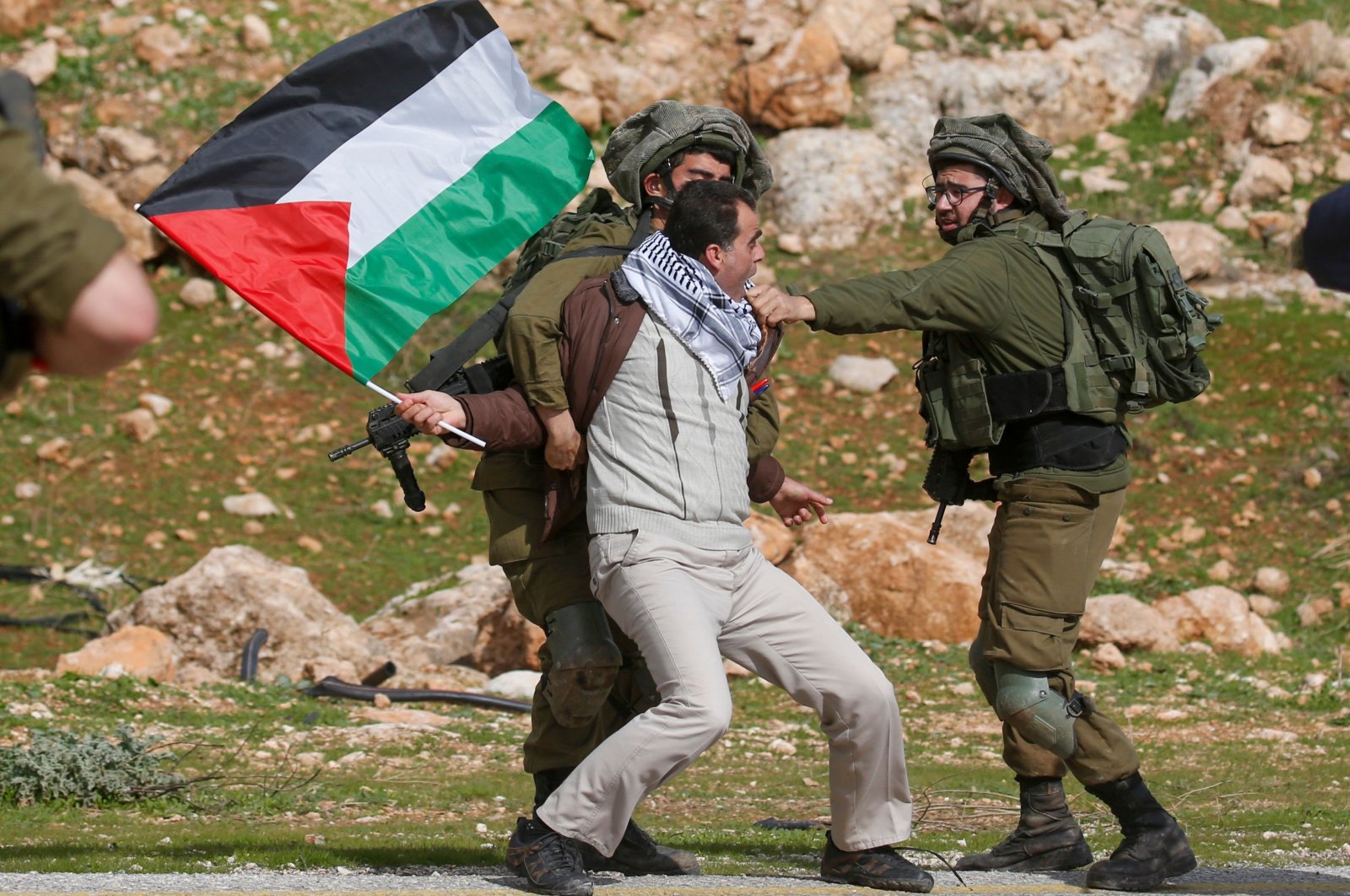 A Palestinian demonstrator is detained by Israeli soldiers during a demonstration against then-U.S. President Donald Trump&#039;s peace proposals, near the West Bank village of Tubas, near the Jordan Valley, Jordan, Jan. 29, 2020. (AFP Photo)