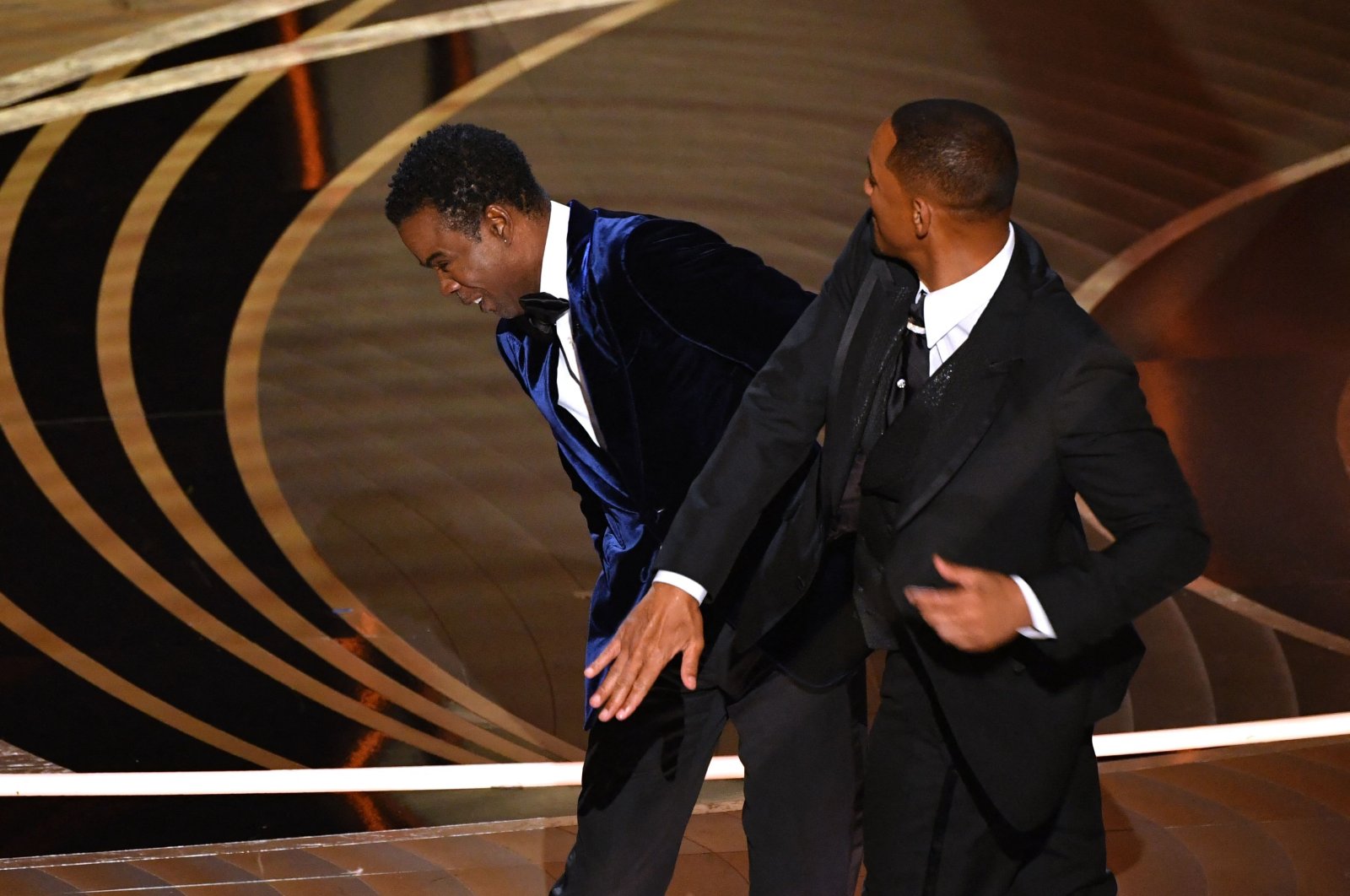 Will Smith (R) slaps Chris Rock onstage during the 94th Oscars at the Dolby Theater in Hollywood, California, U.S., March 27, 2022. (AFP File Photo)
