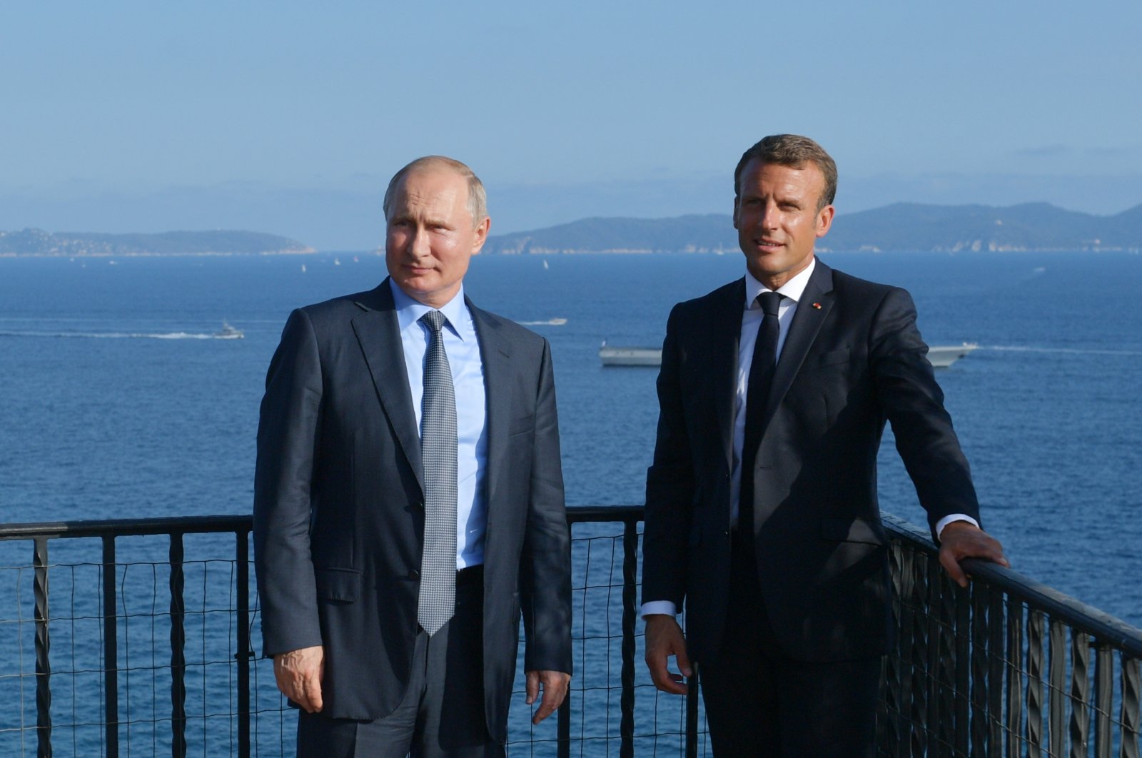 French President Emmanuel Macron, right, and his Russian counterpart Vladimir Putin pose for a photo during their meeting at the fort of Bregancon in Bormes-les-Mimosas, southern France, on Aug. 19, 2019. (AP Photo)