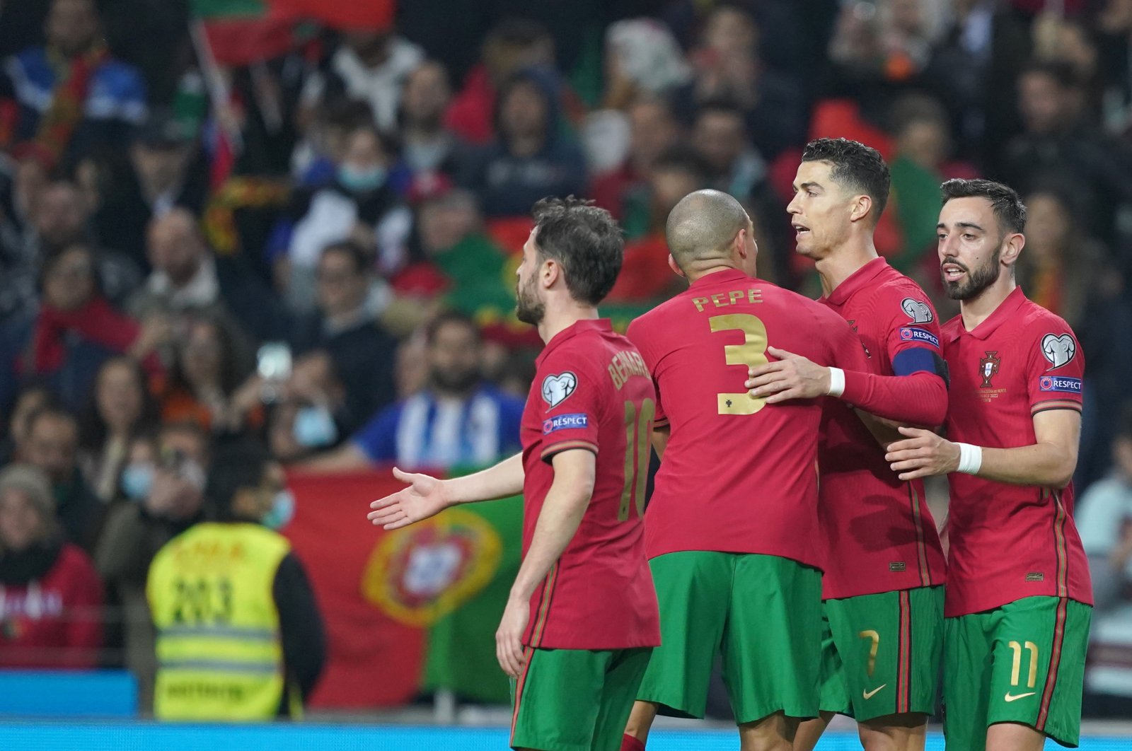 Portugal player Bruno Fernandes (R) celebrates with his teammates after scoring the second goal during the FIFA World Cup Qatar 2022 play-off qualifying soccer match Portugal vs North Macedonia held on Dragao stadium in Porto, Portugal, March 29, 2022.  (EPA Photo)